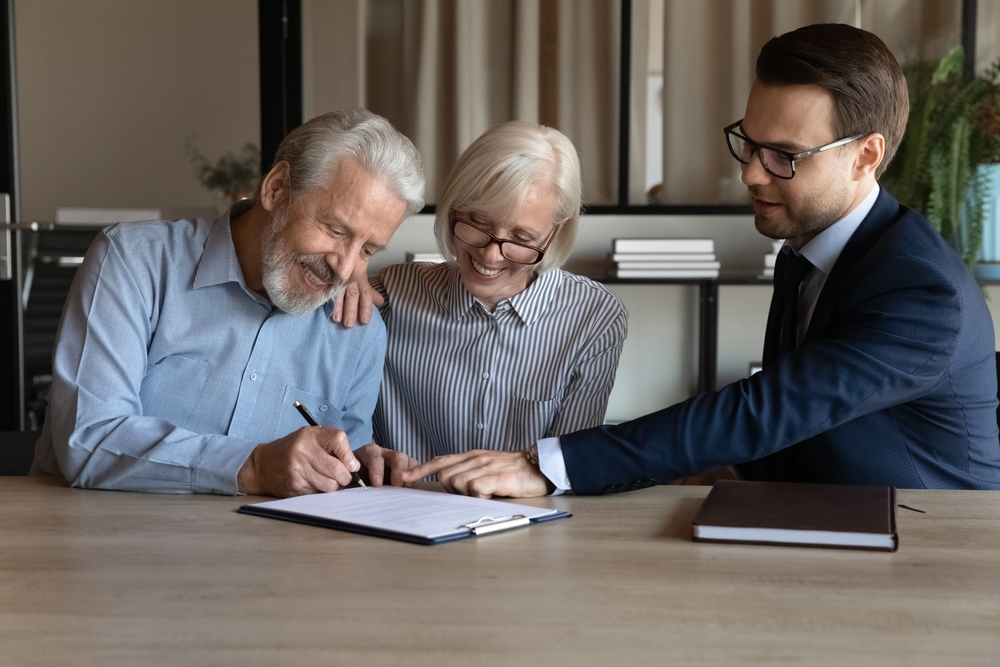 Couple Signing Document Photo of Couple Signing Document